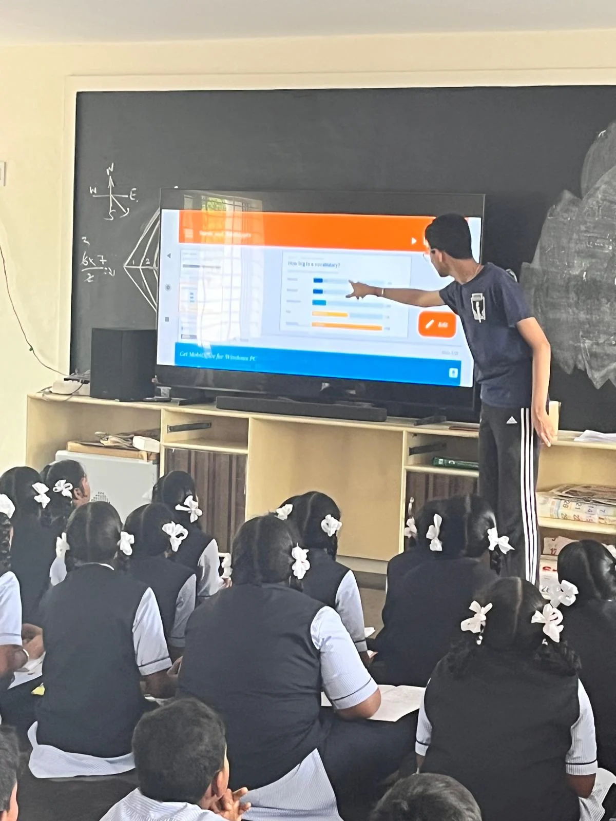 Students watching a MathCore demonstration on a classroom screen.